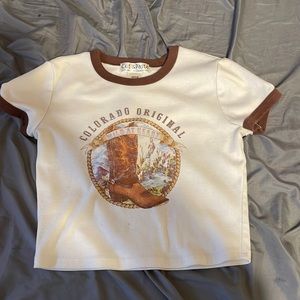 size medium, color is a light cream, with brown lining